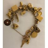 Good 9ct gold charm bracelet 48.4gms total.