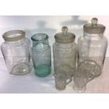 Four vintage glass sweet jars, 34cms t and two glass cream jugs.