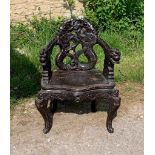 Decorative ebonised ceremonial chair