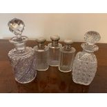 Five glass scent bottles, 3 silver tops and one Baccarat Twisted bamboo pattern