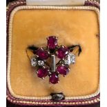 Ruby and diamond ladies dress ring size P set in unmarked yellow metal