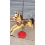 A painted carousel horse, 98 w x 193cms h.