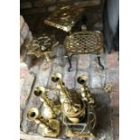 Brass ware including kettle stands, candlesticks, toasting fork and lamp.