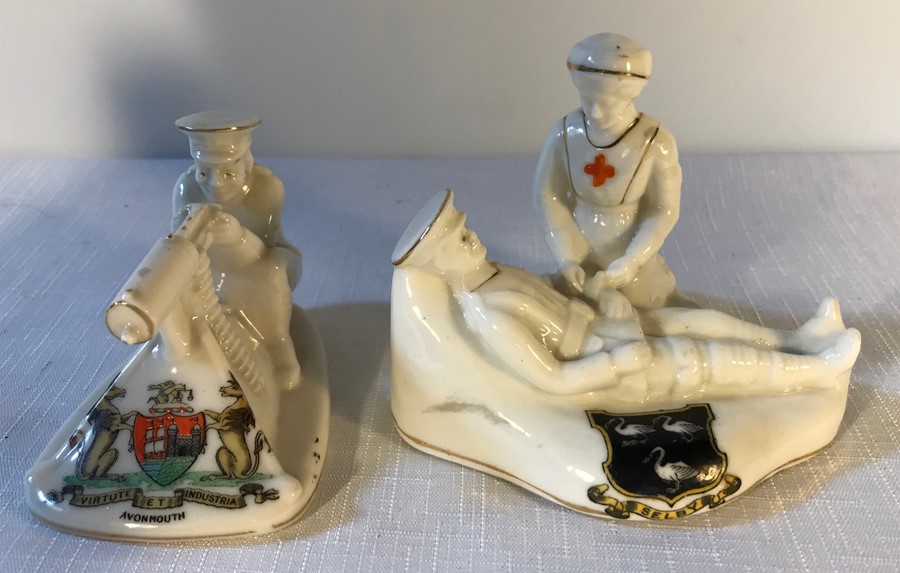 Two crested ware models, Arcadian Tommy and his machine gun and soldier and nurse.