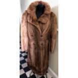 A mink coat to fit approximately size 12.