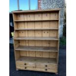 Large pine bookcase with drawers to base.