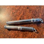 Two Sampson Mordan silver propelling pencils both with pencils