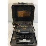 Victorian Empire typewriter circa 1892 in tin carry case.