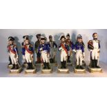 12 Sitzendorf military figures, 1 damaged. 26cms h.