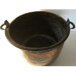 Brass iron bound cauldron. 42cms d, 29cms h. repair to base.