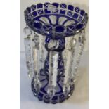 A 19thC blue glass lustre vase. 26cms h.