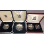 A Royal Mint 1990 £5 coin, a 1989 £2 coin and two 1990 5 pence coins.