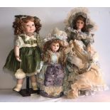 Three good quality modern porcelain headed dolls. H - 56cms.