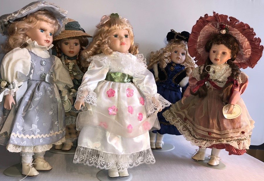 Six good quality modern porcelain headed dolls.- H - 44cms.
