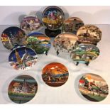 A collection of Poole England pottery plates with many scenes. Spring, Summer, Autumn, Winter and