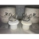 Swarovski centenary Swan 187407 on stands x 2. SLight a/f to one stand. Boxed and mint.