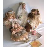 Four good quality modern porcelain headed dolls and key ring. H - 44cms.