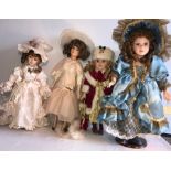 Four good quality modern porcelain headed dolls - 55cms.