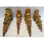Four sets of hand painted wooden Russian Dolls, tallest approx 16cms.