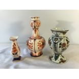 Delft blue and orange vases, 20.5cms h 11.5cms and a floral painted Delft vase, 15.5cms h.