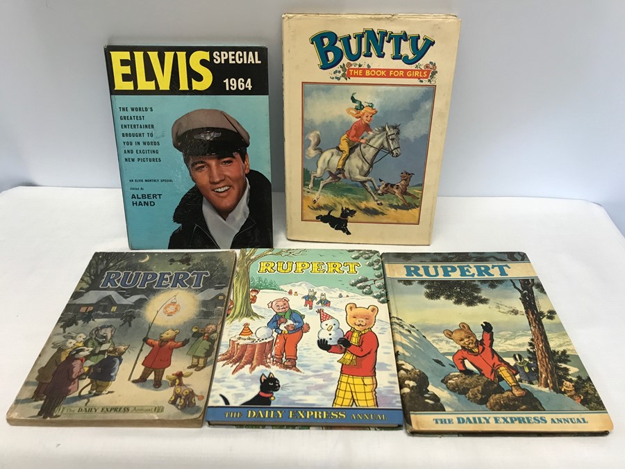 Collection of 5 assorted annuals. Elvis Special 1964, Bunty and 3 Rupert Bear annuals, 1974.