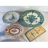 Delft green charger, 29.5cms w, Delft brown plate poon, 23cms w and a Delft floral dish, 21cms w.