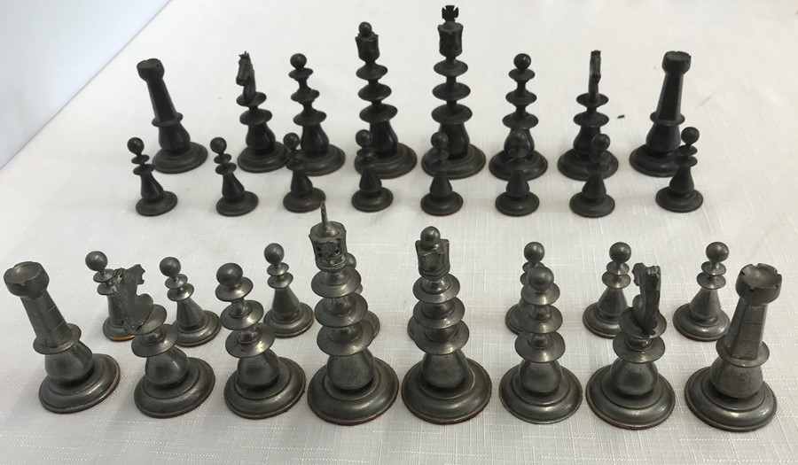 A complete pewter chess set. King 10cms h.