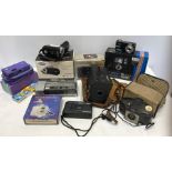 A collection of vintage and modern cameras to include Olympus Trip, Kodak Junior box camera, Kodak
