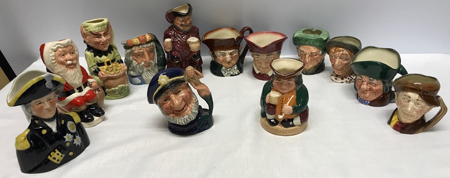 Collection of small Toby jugs, 12 Royal Doulton inc Father Christmas, Leprechaun, Old salt, Neptune,