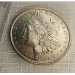 An 1885 USA silver morgan dollar, 0.865 ozt.