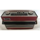 Roberts R23 revolving portable radio, red leatherette with teak wood sides.