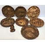 Collection of carved wooden decorative wall plaques, Switzerland and Austria.