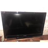 A 32'' Panasonic Vierra television with DVD player and remotes.