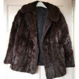 Ladies waist length fur coat, a/f to back, 63cms long, 49cms armpit to armpit.