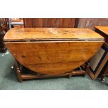 AN EARLY 18TH CENTURY OAK DROP LEAF GATE LEG DINING / SOFA TABLE, with two drop leaves, raised on