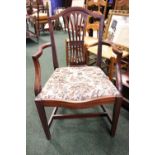 AN EARLY 20TH CENTURY ARM CHAIR with pierced splat back, embroidered lift up seat