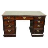 AN EARLY 20TH CENTURY MAHOGANY PEDESTAL DESK, with green leatherette top, over 3 frieze drawers