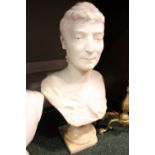 A MARBLE BUST OF A FIGURE