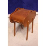 A MID CENTURY MODERN, WOODEN TAMBOUR ROLL-TOP SEWING BOX, possibly Danish, raised on four ‘
