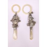 A PAIR OF SILVER BABY’S RATTLES, (i) Mr Punch, silver rattle with mother of pearl handle and