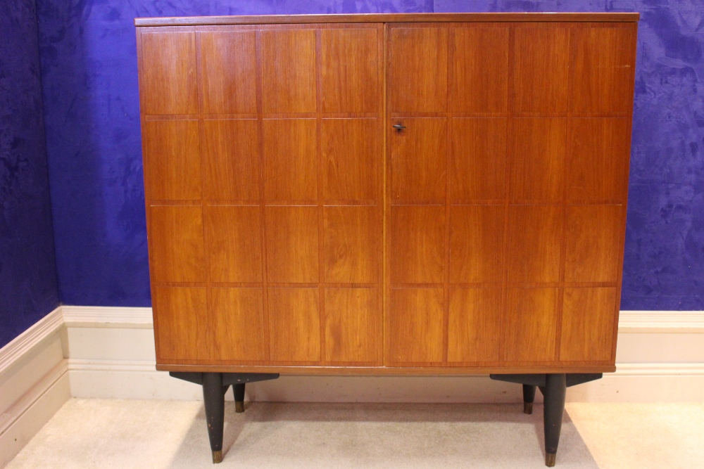 A MID CENTURY MODERN SWEDISH CABINET, circa 1950, two door cabinet, decorated with relief panels,