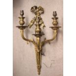 A BRASS WALL LIGHT WITH 3 LIGHT BRANCHES, decorated with a large flowing ribbon bow and reeded