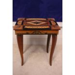 AN INLAID MUSIC BOX / SEWING TABLE, with lift up top, compartments within, with key, 17" x 14.5" x