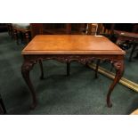 A COFFEE / LAMP TABLE, raised on cabriole leg with draped acanthus leaf carving to the knees and