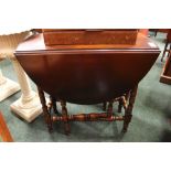 A SMALL MAHOGANY DROP LEAF TABLE, with turned gated legs, 29" x 32" x 14" approx down