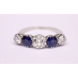 A 5 STONE PLATINUM GRADUATED RING, two sapphires, 3 diamonds, marked PLAT to inside, no other
