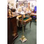 BRASS CORINTHIAN COLUMN STANDARD LAMP, on square base, terminating in paw feet, having Corinthian