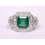 AN 18CT WHITE GOLD EMERALD & DIAMOND CLUSTER RING, 1.50 emerald .1.35 diamonds
