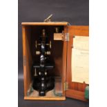 AN EARLY 20TH CENTURY CHARLES PERRY MICROSCOPE, lacquered body to scope, numbered 5776, circa