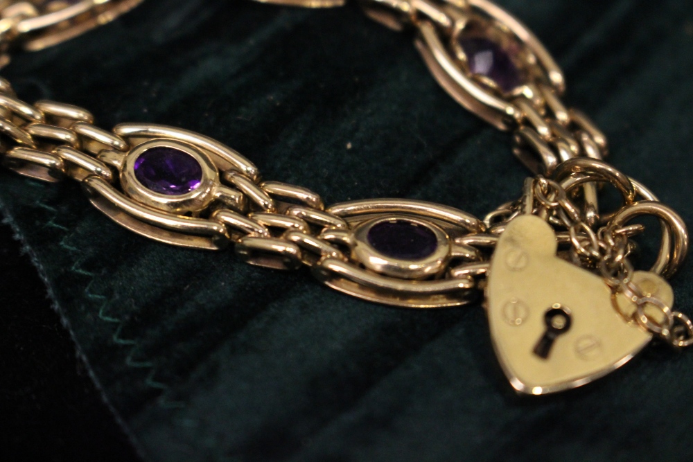 A 9CT GOLD LINK BRACELET, with heart shaped lock and pink stones - Image 2 of 3